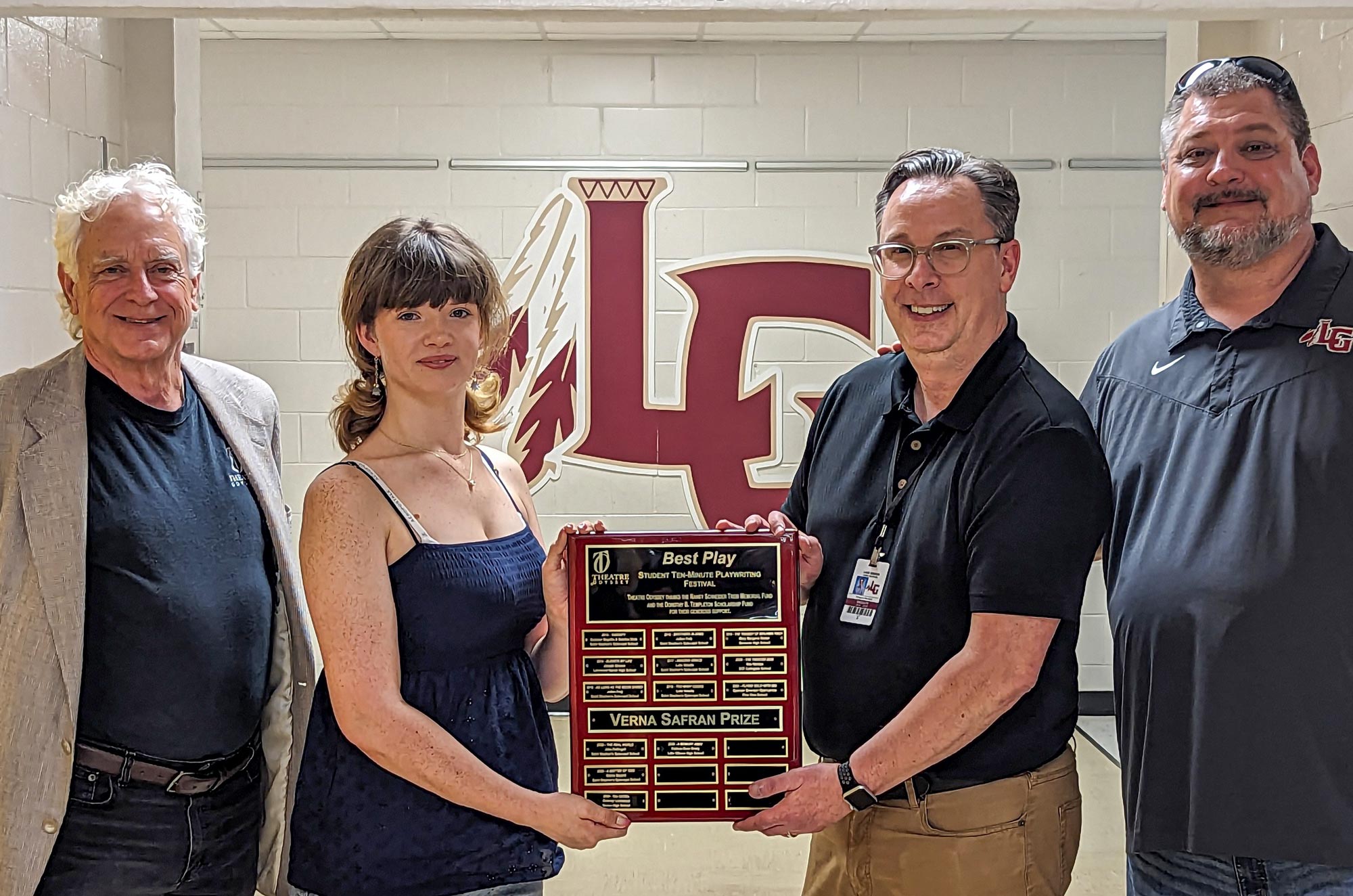 Preston,-Patricia-Brady,-Burdick,-Vann Theatre Odyssey Director Emeritus Preston Boyd with Patricia Rose Brady (playwright), Greg Burdick (drama teacher), and Ryan Vann (principal, Lake Gibson High School). Winner of the Verna Safran Prize for Best Play, Brady’s name has been added to the plaque which will be displayed at Lake Gibson High (Lakeland) until next year's Festival.